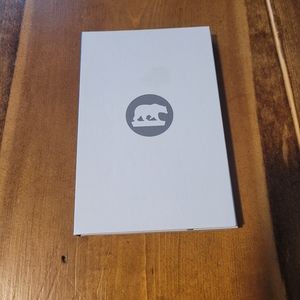 4 Ocean polar bear white and grey bracelet with placement holder.